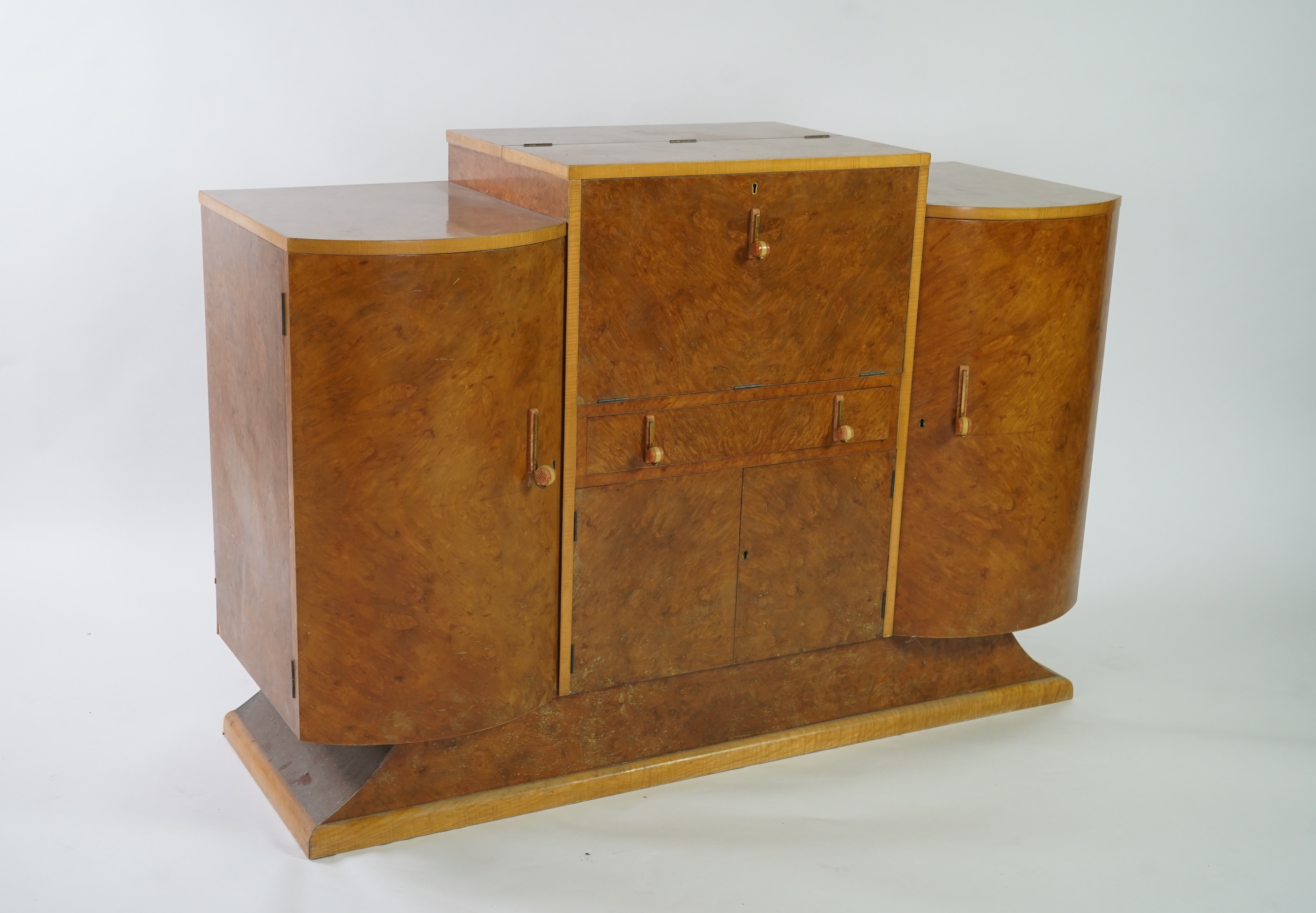 Attributed to Harry and Lou Epstein: An Art Deco burr walnut dining suite